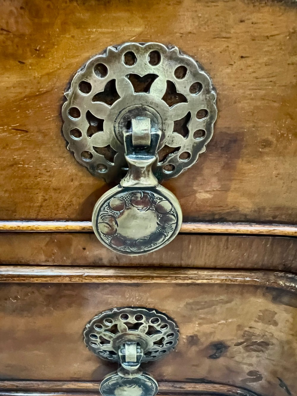 A burr walnut lowboy side table featuring five drawers, brass drop handles, a shaped apron, and four cabriole legs. View VII