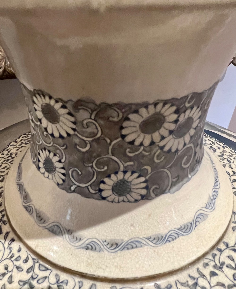 A pair of large Japanese Satsuma earthenware vases featuring painted blue and grey peonies, molded lion head handles, and a crackled cream glaze. View XI