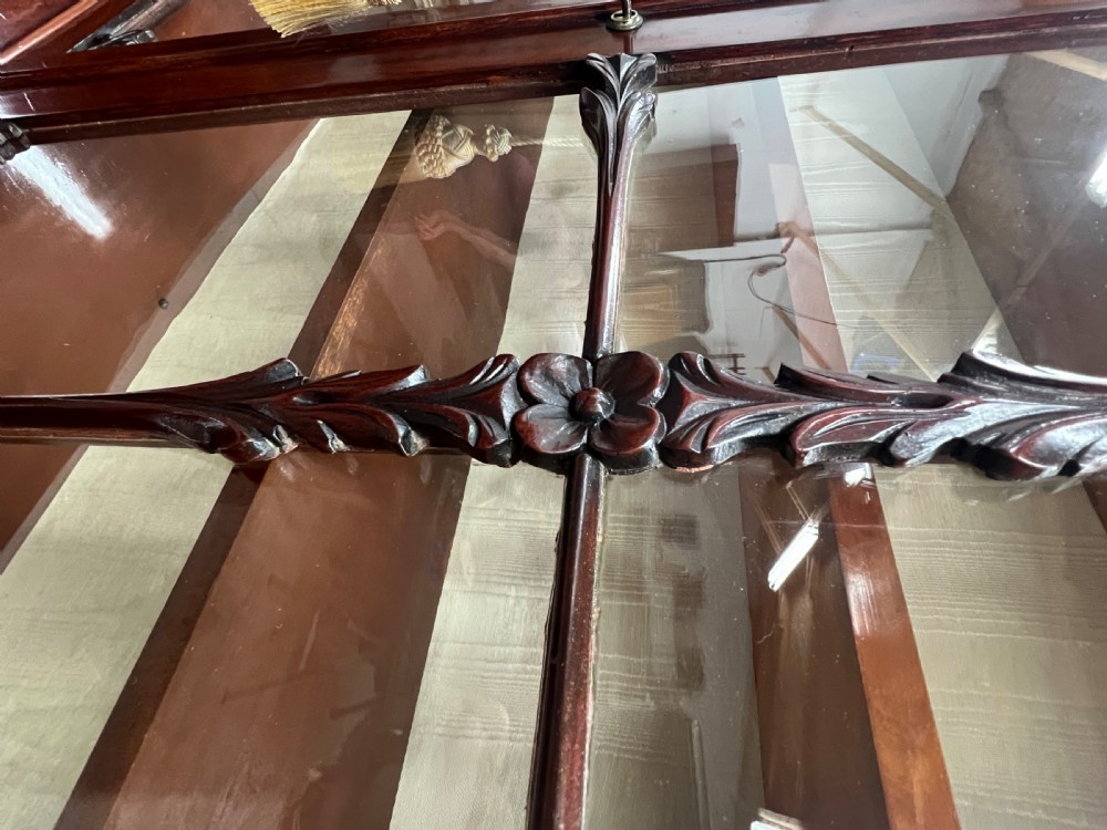 An antique mahogany secretaire bookcase featuring glazed upper doors, a middle drawer with turned knobs, and a double-door lower cabinet. View IV
