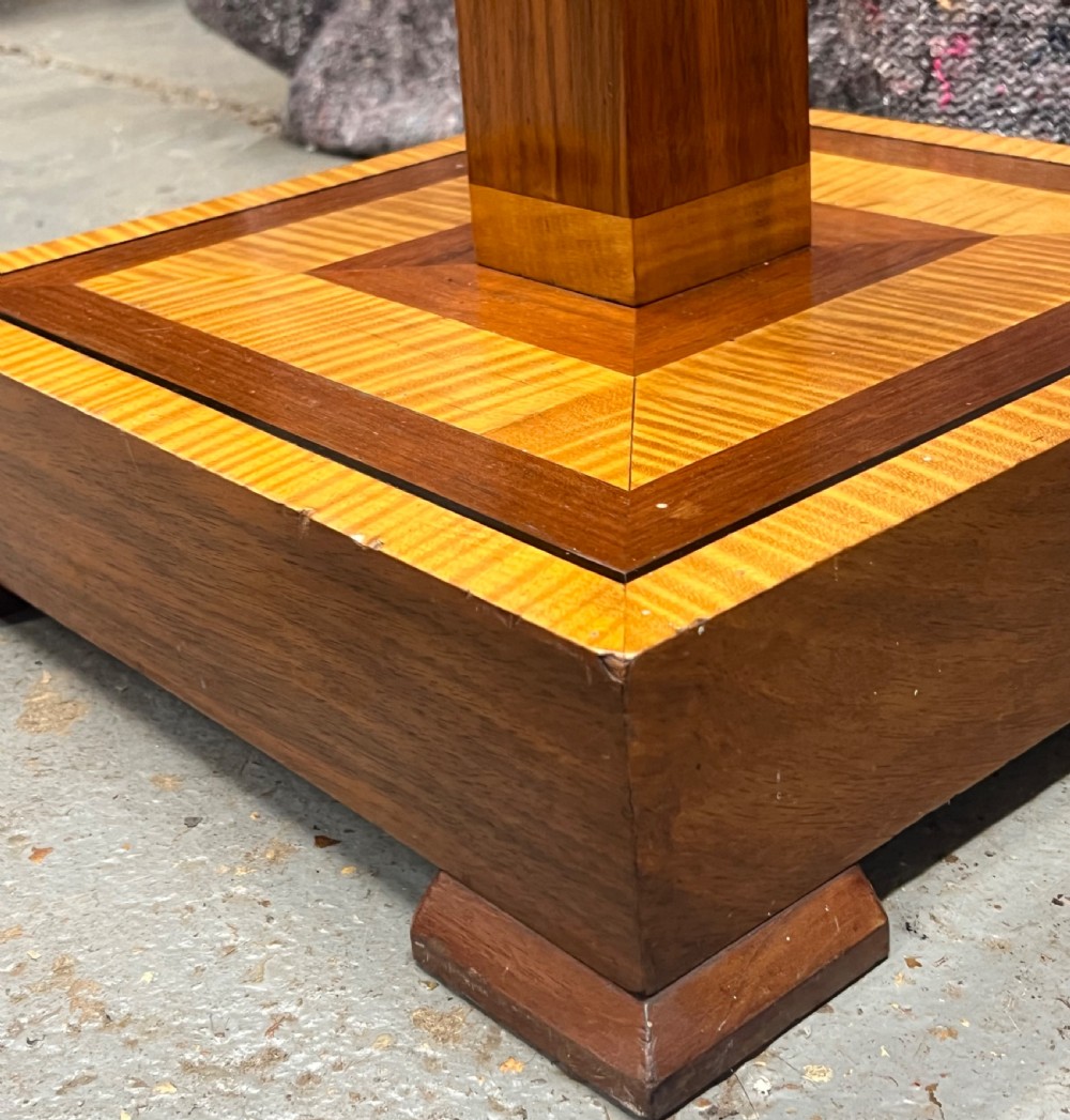 An Art Deco wooden standard lamp featuring a square column with contrasting inlaid bands set upon a stepped, multi-toned geometric base. View III
