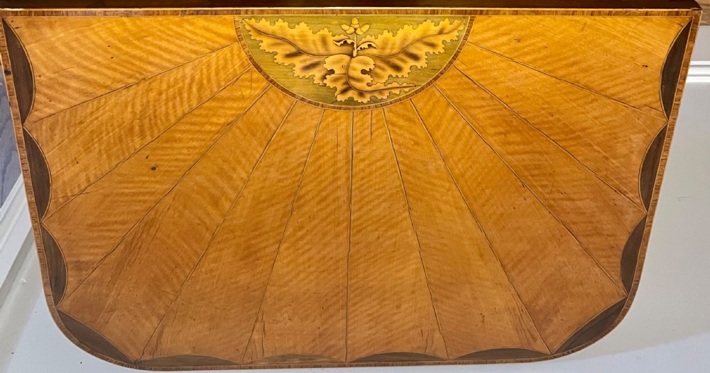 A Sheraton Revival satinwood side table featuring sunburst fan marquetry inlay and tapered legs. View II