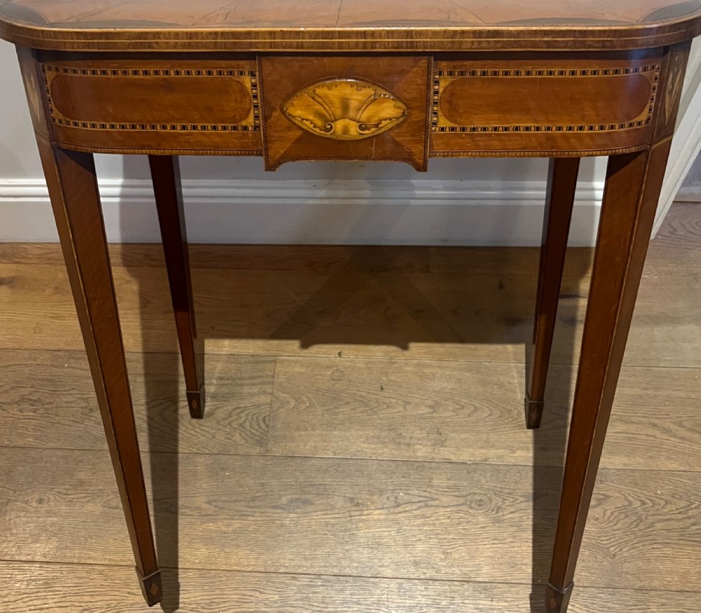 A Sheraton Revival satinwood side table featuring sunburst fan marquetry inlay and tapered legs. View IV