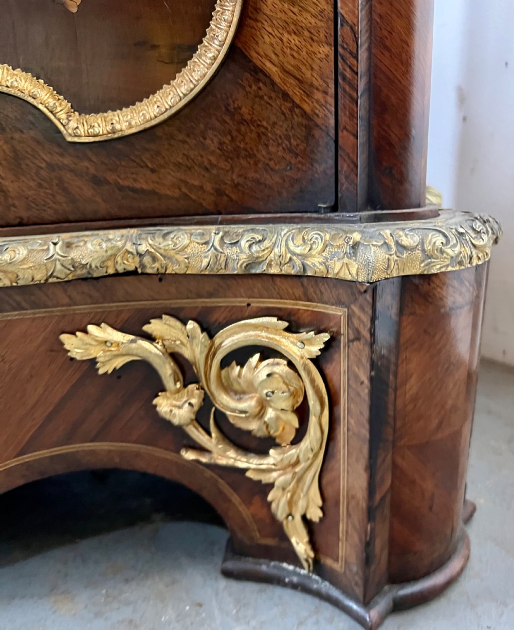 A pair of French Louis XV style kingwood side cabinets featuring floral marquetry, gilt-bronze ormolu mounts, and shaped pink marble tops. View XIII
