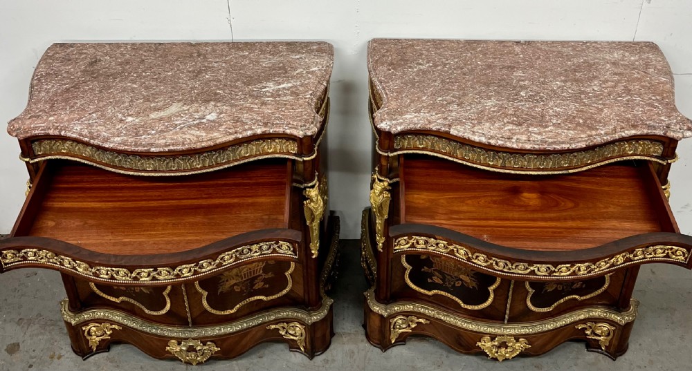 A pair of French Louis XV style kingwood side cabinets featuring floral marquetry, gilt-bronze ormolu mounts, and shaped pink marble tops. View XVII