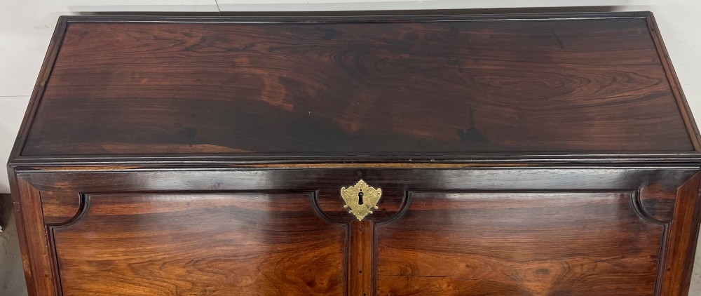 An 18th-century dark rosewood slant-front bureau shown open, featuring a stepped fitted interior, brass drop handles, and three long drawers below. View XV