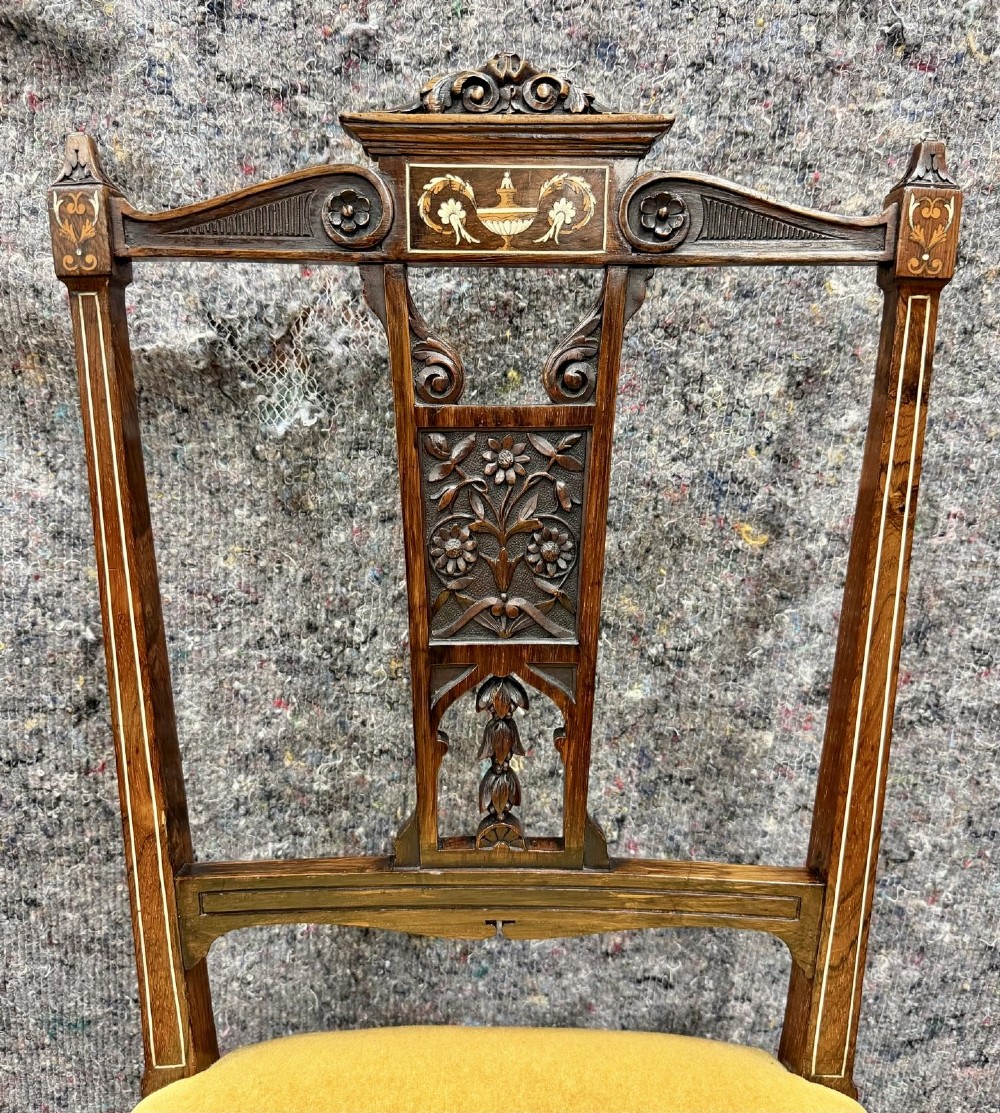 A set of four late Victorian inlaid rosewood side chairs featuring carved back splats with urn marquetry and yellow upholstered seats. View III