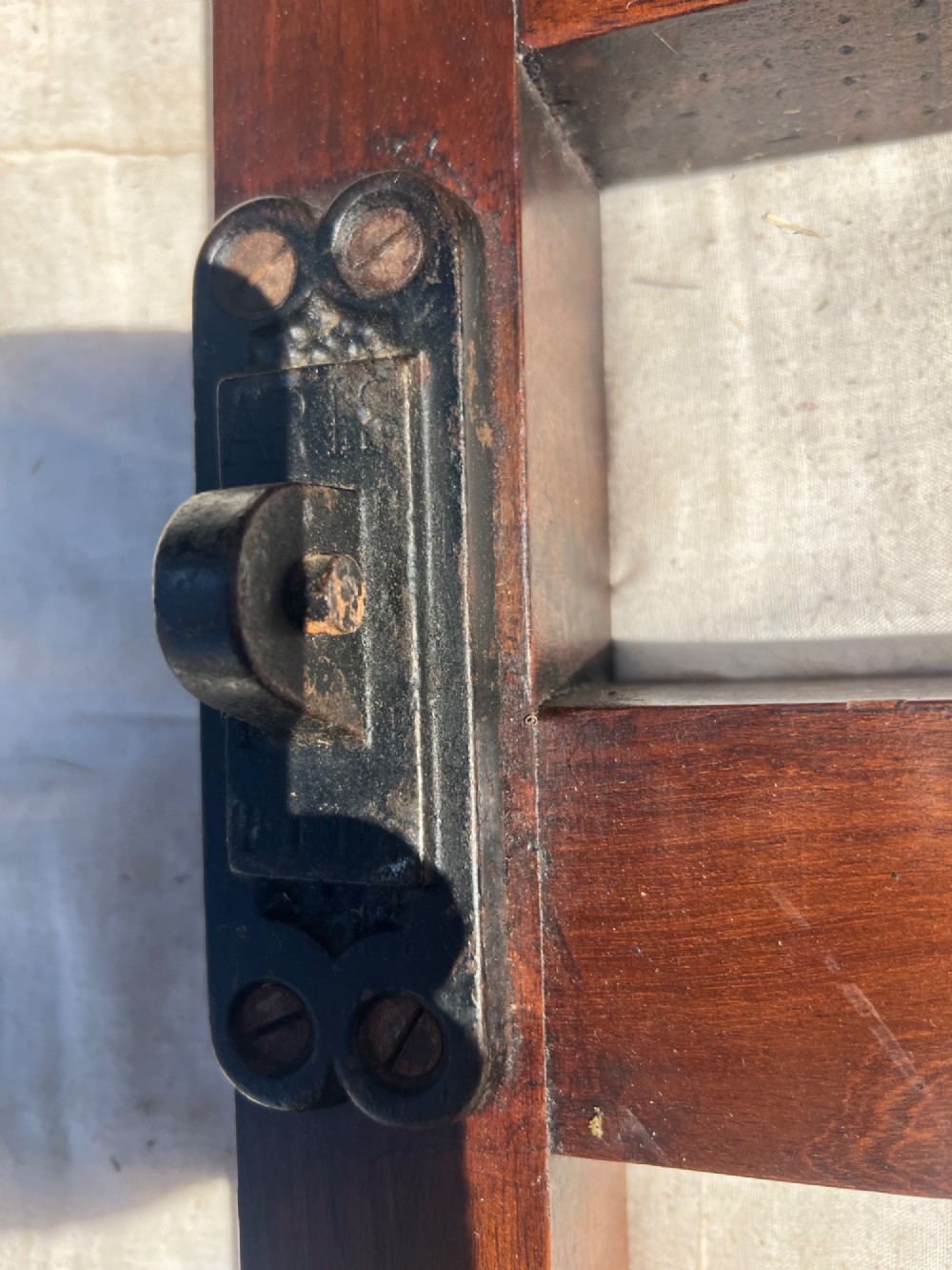 A pair of antique Chippendale style mahogany single bed frames featuring carved pierced back splats, yoke crest rails, and cabriole legs ending in claw and ball feet. View XV