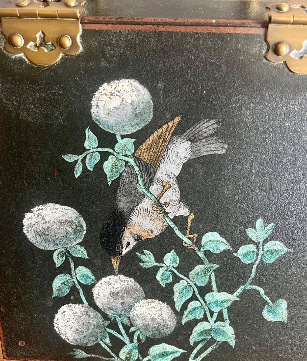 An antique dark green toleware coal scuttle featuring a slant front with a hand-painted bird and floral motif, brass hinges, and a brass top handle. View IV