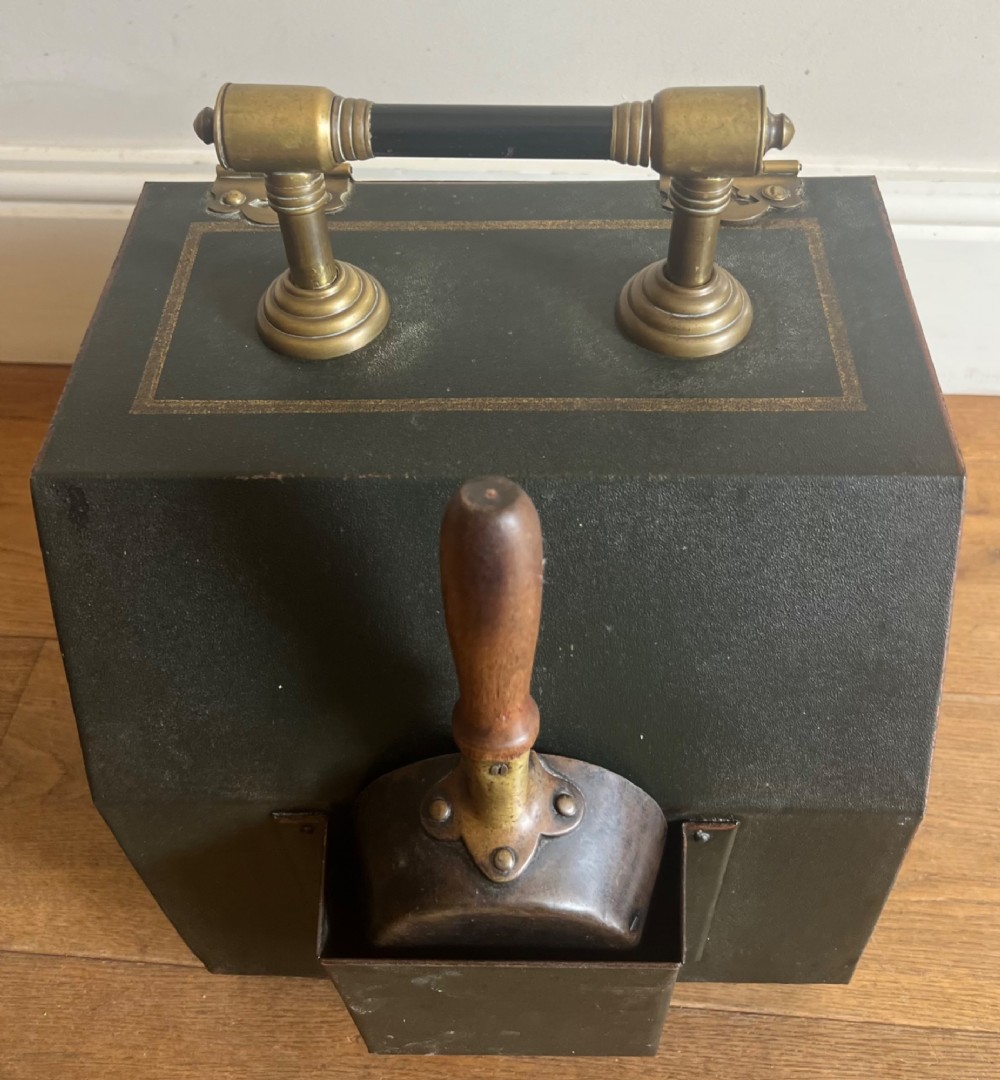 An antique dark green toleware coal scuttle featuring a slant front with a hand-painted bird and floral motif, brass hinges, and a brass top handle. View V