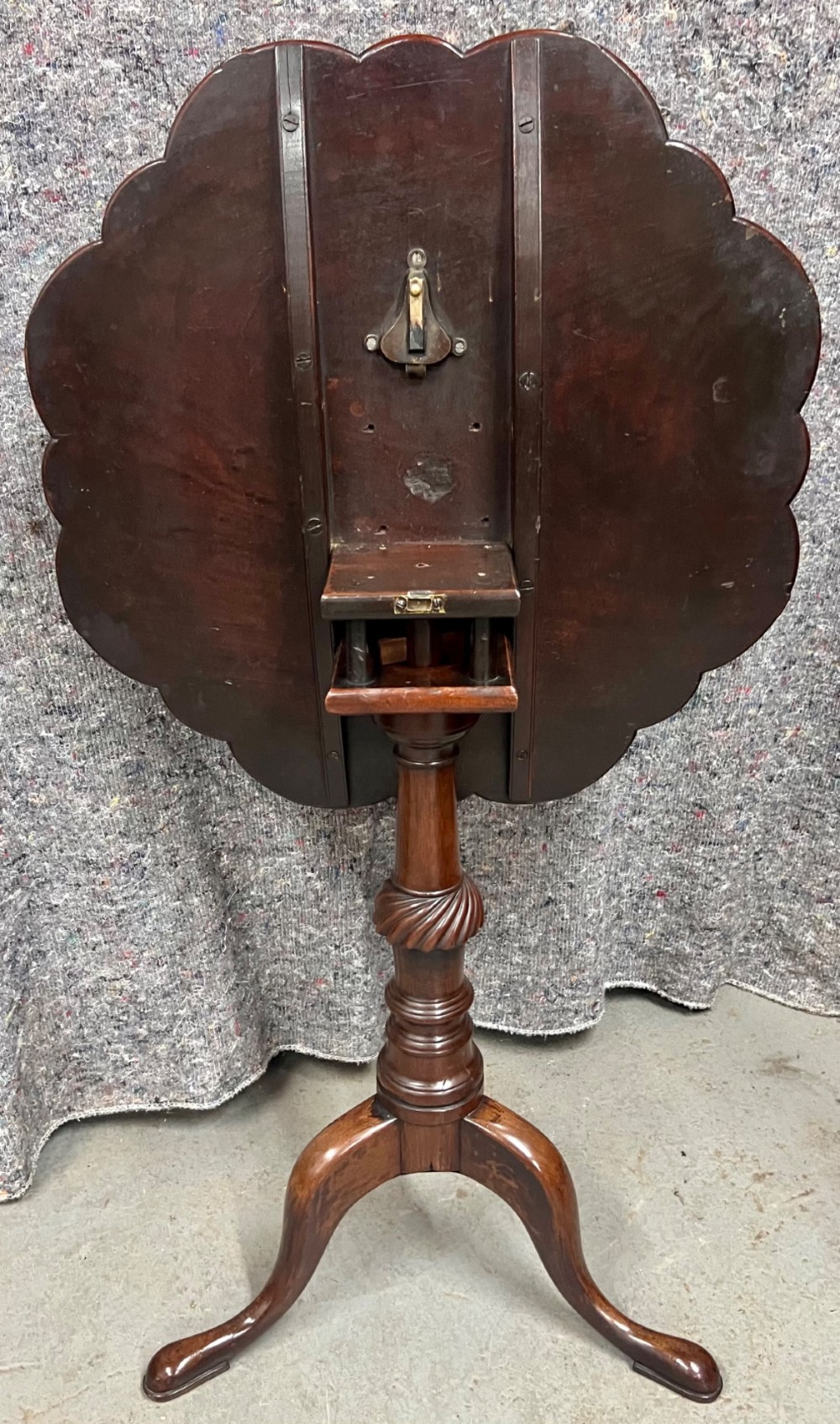 A George III mahogany tripod table featuring a scalloped piecrust rim, an inlaid chessboard top, a turned pedestal, and three cabriole legs. View VIII