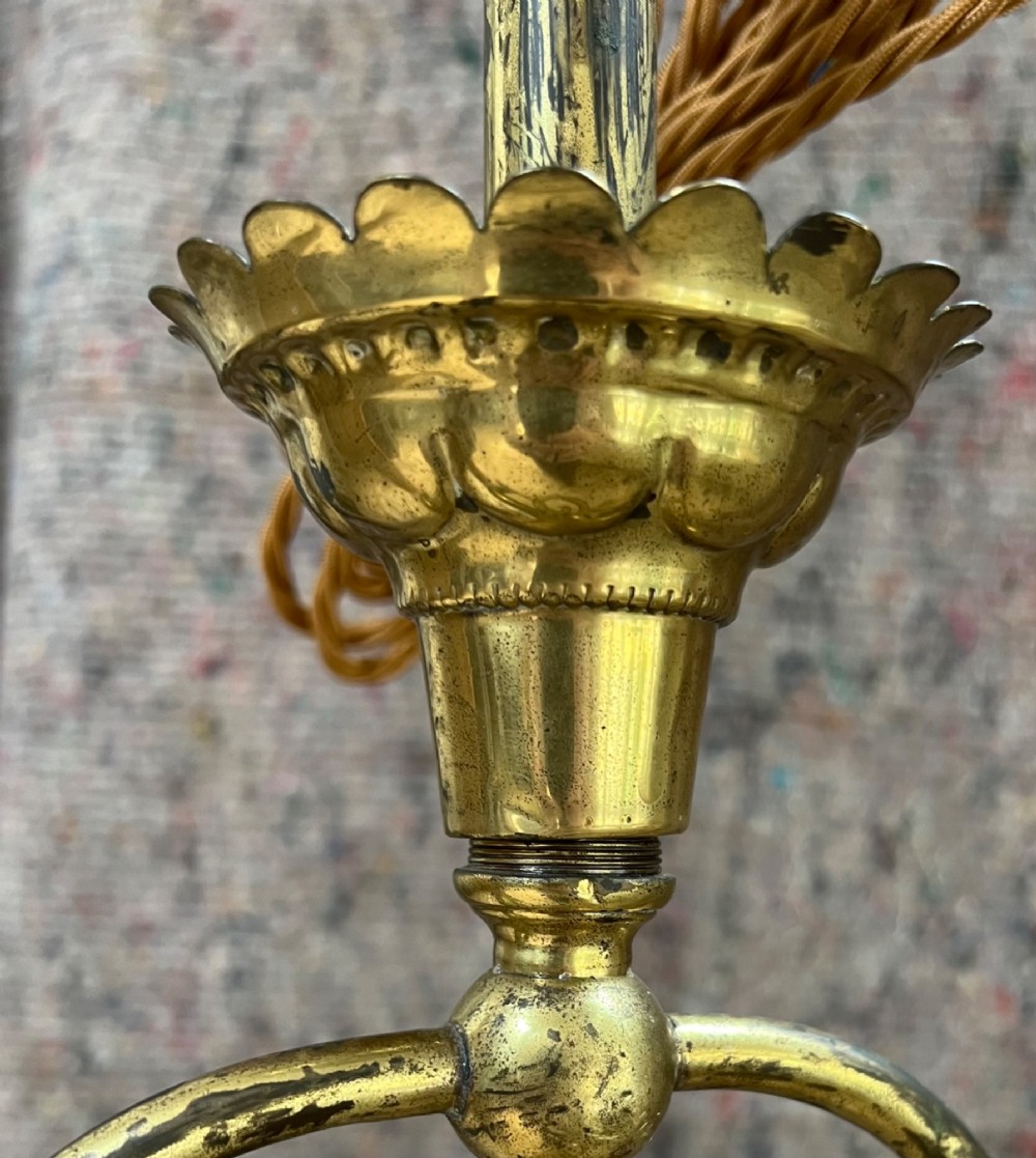 An antique brass hanging pendant lantern featuring a contoured brass frame suspending a moulded pink and amber glass shade. View III