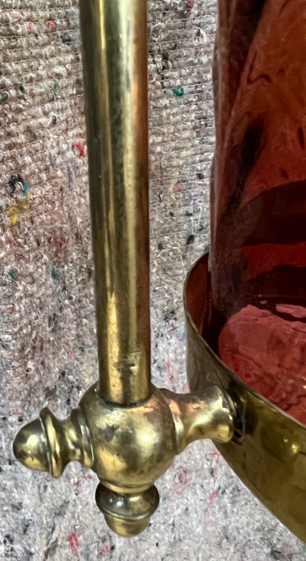 An antique brass hanging pendant lantern featuring a contoured brass frame suspending a moulded pink and amber glass shade. View IX
