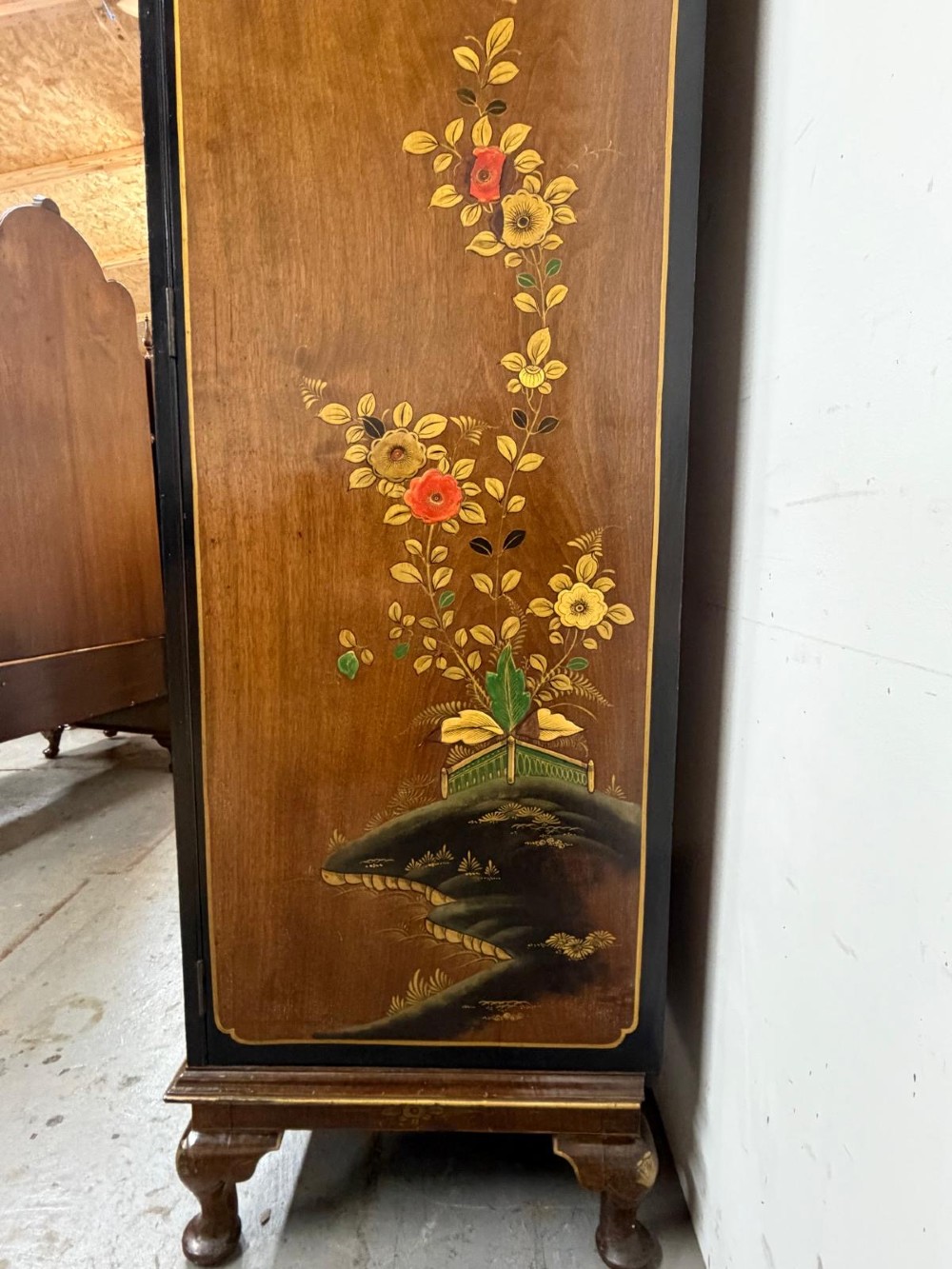 A two-door wooden compactum wardrobe decorated with hand-painted Chinoiserie scenes, pagodas, and figures set within dark lacquered borders. View XI