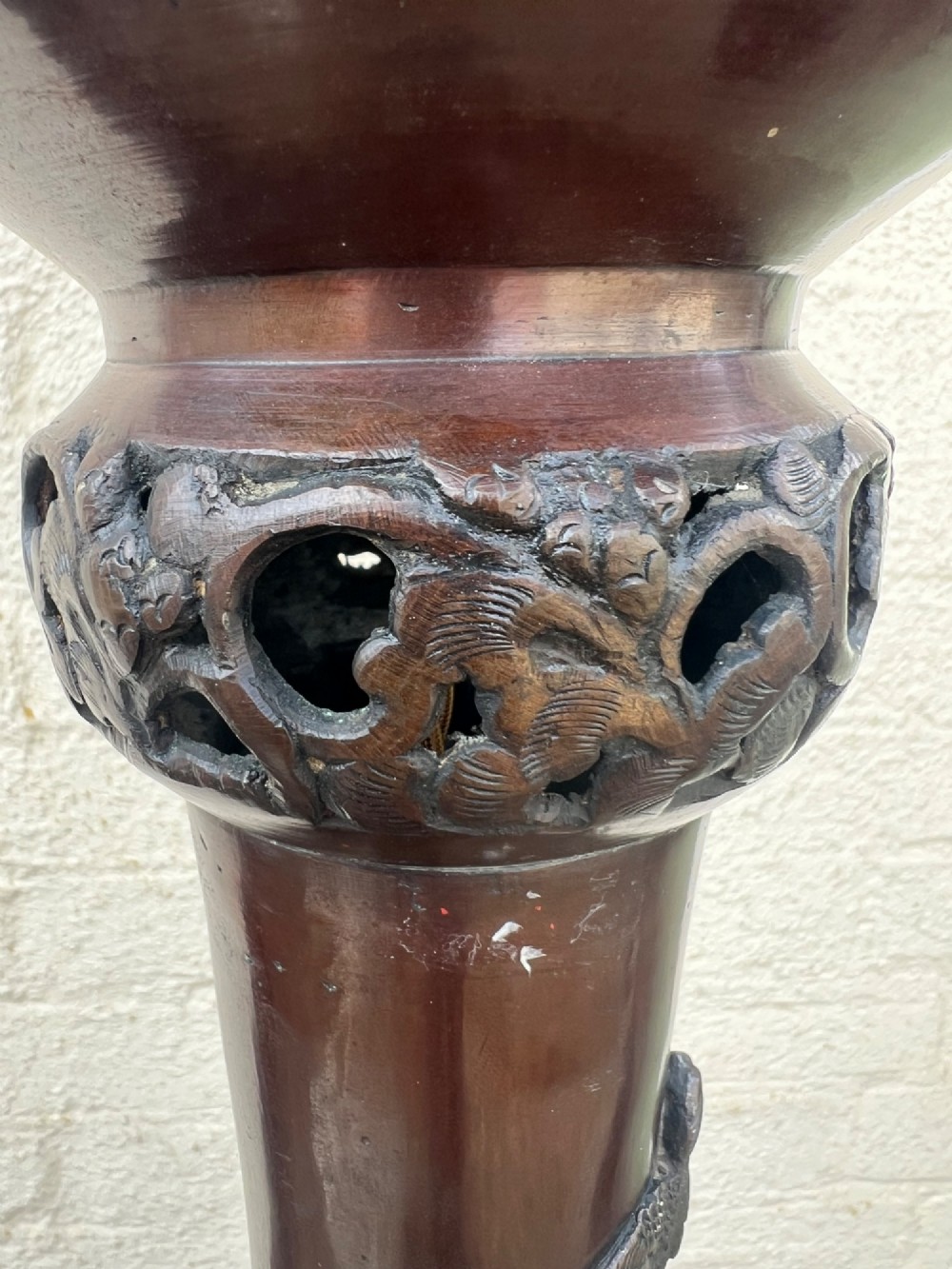 A tall Japanese Meiji period dark bronze floor lamp featuring high-relief relief castings of birds and floral branches along a baluster column. View XI