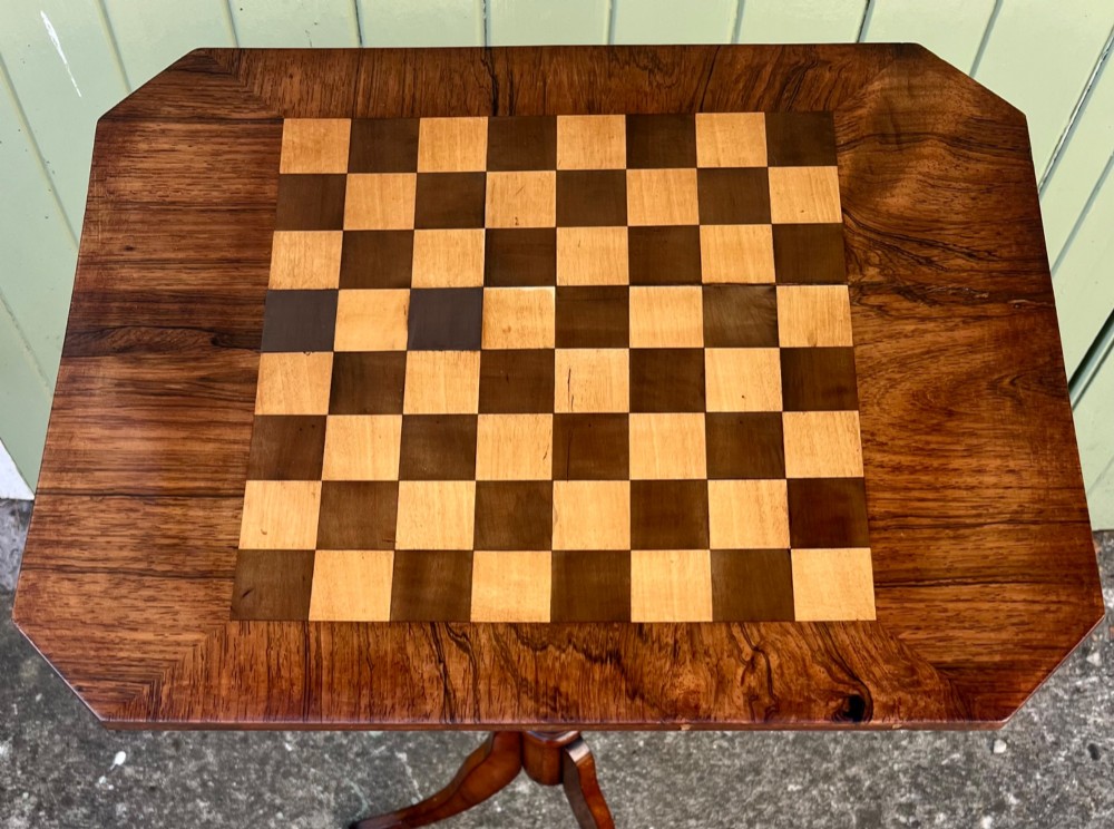 An antique rosewood chess table featuring an octagonal top inlaid with a geometric chessboard, supported by a turned central pedestal and a tripod base. View II