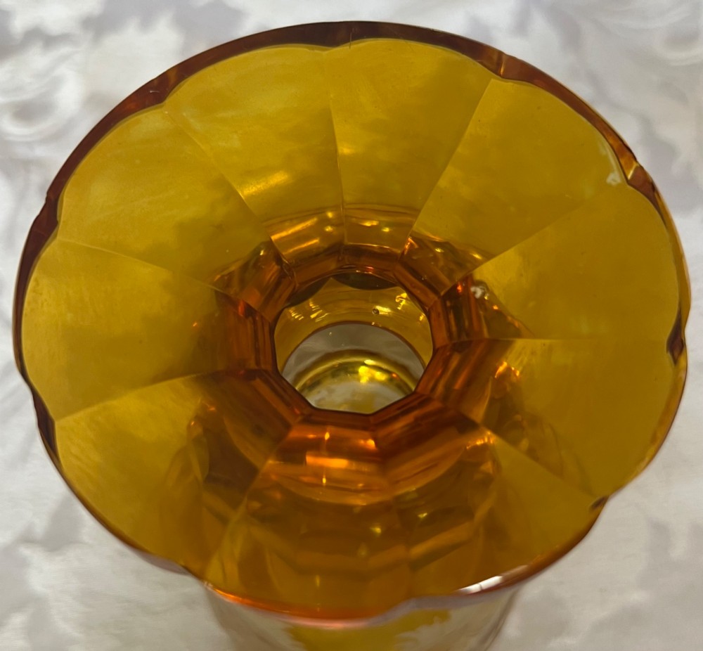 An amber glass lidded pokal vase featuring wheel-engraved woodland imagery with a stag, a faceted stem, and a stepped lid. View IX
