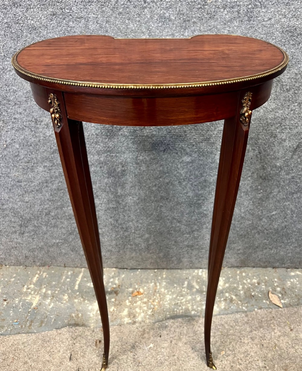 A tall mahogany kidney-shaped occasional table featuring slender cabriole legs, a beaded gilt bronze rim, and a central blue jasperware medallion framed in ormolu. View V