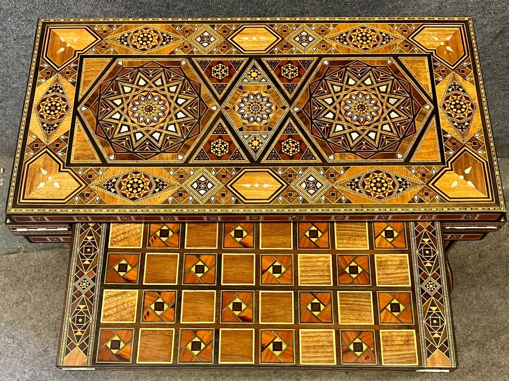 A Syrian games table featuring geometric micro-mosaic wood inlay, curved cabriole legs, and a fitted lower shelf. View IV