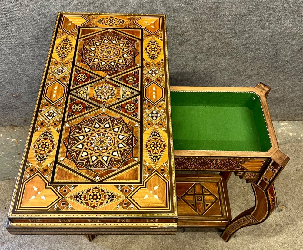 A Syrian games table featuring geometric micro-mosaic wood inlay, curved cabriole legs, and a fitted lower shelf. View V