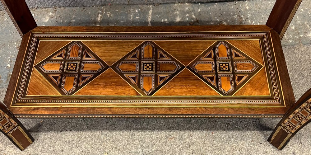 A Syrian games table featuring geometric micro-mosaic wood inlay, curved cabriole legs, and a fitted lower shelf. View XII