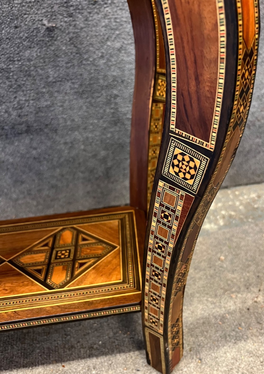 A Syrian games table featuring geometric micro-mosaic wood inlay, curved cabriole legs, and a fitted lower shelf. View XIII