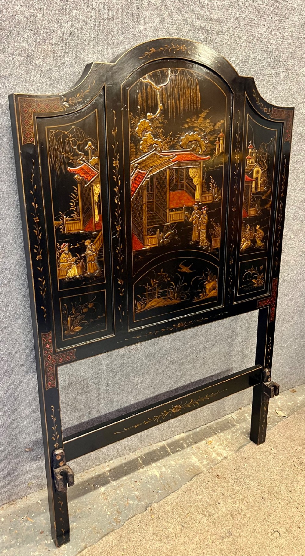 A black lacquered single bedstead featuring hand-painted gold Chinoiserie architectural scenes, arched top panels, and carved cabriole legs. View IV