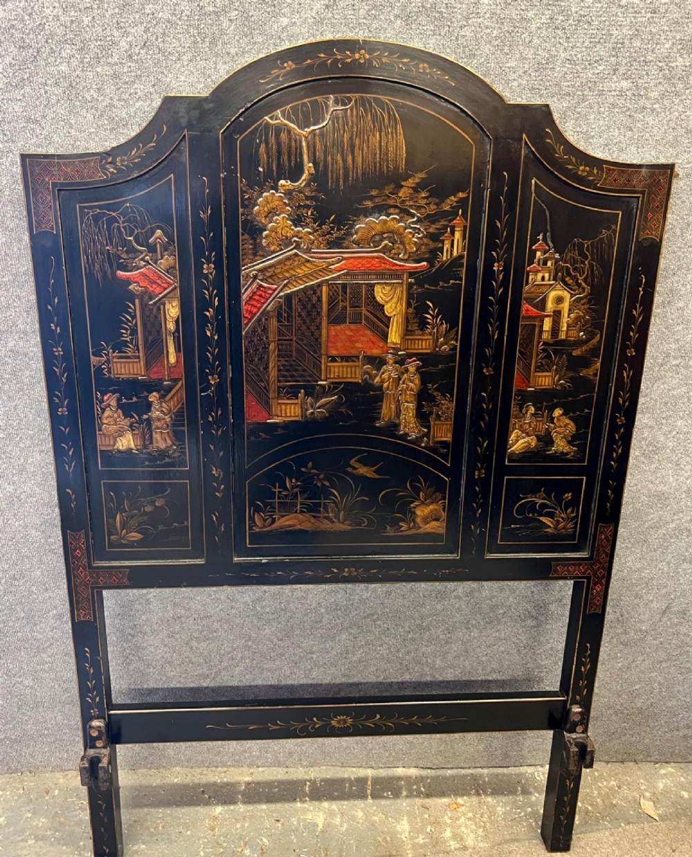 A black lacquered single bedstead featuring hand-painted gold Chinoiserie architectural scenes, arched top panels, and carved cabriole legs. View VIII
