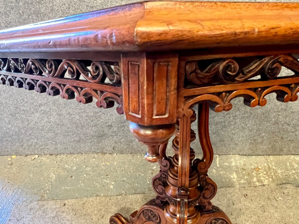 A 19th-century hexagonal specimen wood table featuring a geometric optical illusion parquetry top set on a carved central pedestal base. View VI