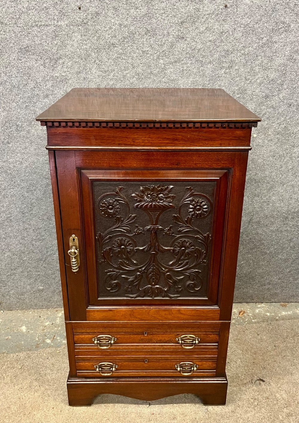 A Victorian mahogany cabinet with an open door revealing an internal Cyrus Price and Company iron safe above two lower drawers. View III