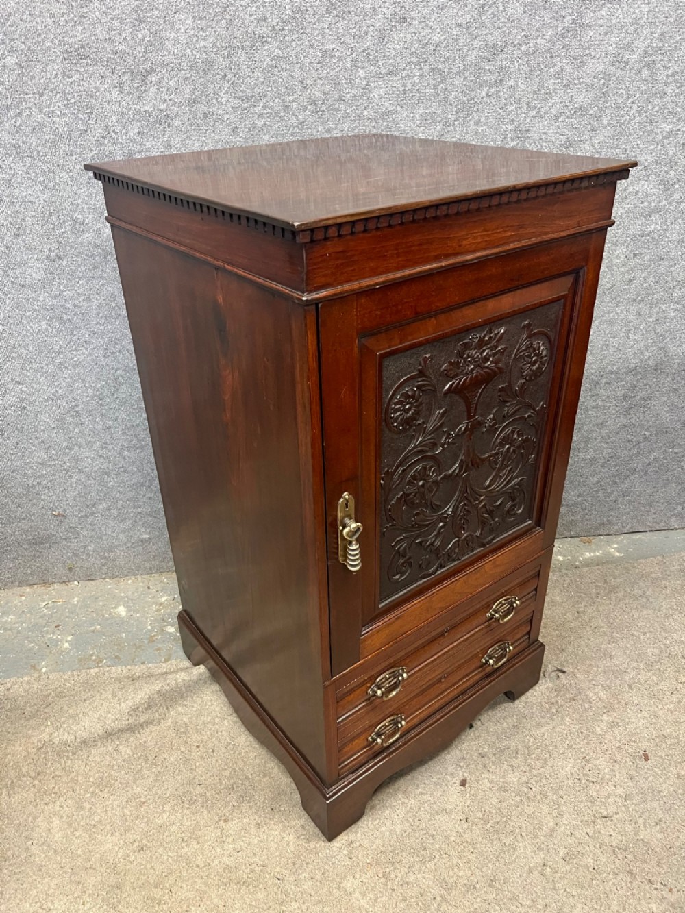 A Victorian mahogany cabinet with an open door revealing an internal Cyrus Price and Company iron safe above two lower drawers. View VI