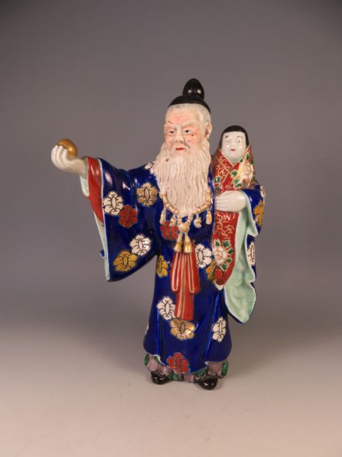 antique japanese meiji period kutani okimono man holding child - CATEGORY: ANTIQUE CERAMICS - DATED 1900