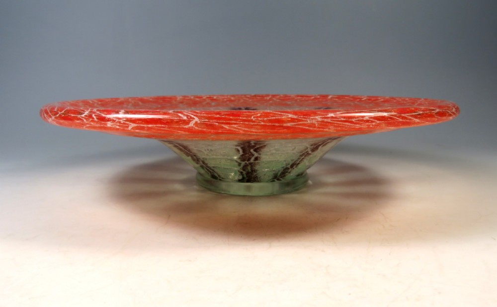 A circular Art Deco WMF Ikora glass bowl featuring a bright red crackle-effect rim and a clear centre with dark starburst inclusions. View II