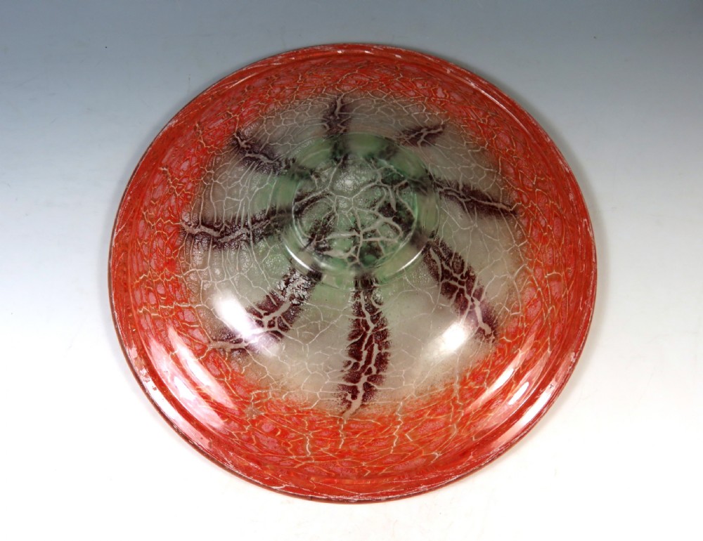 A circular Art Deco WMF Ikora glass bowl featuring a bright red crackle-effect rim and a clear centre with dark starburst inclusions. View IV