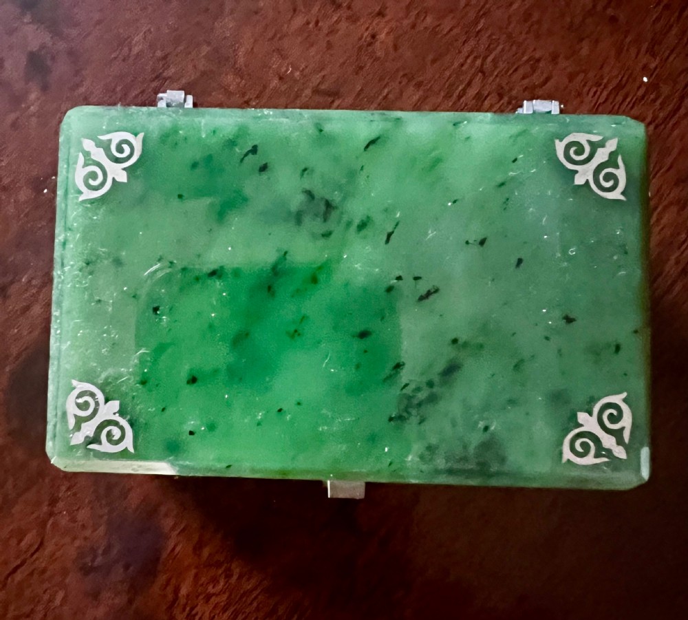 A rectangular polished green stone trinket box featuring metal corner mounts and a metal latch on the front. View II