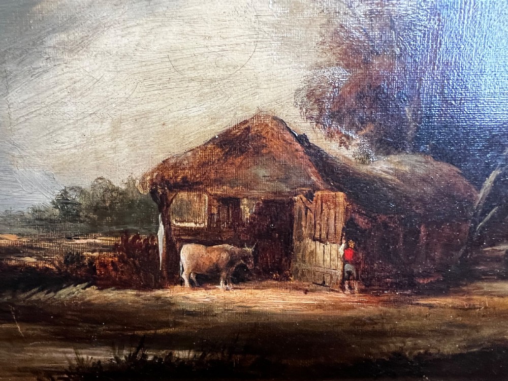 An antique oil painting on canvas depicting a rustic rural landscape with a thatched barn and livestock.