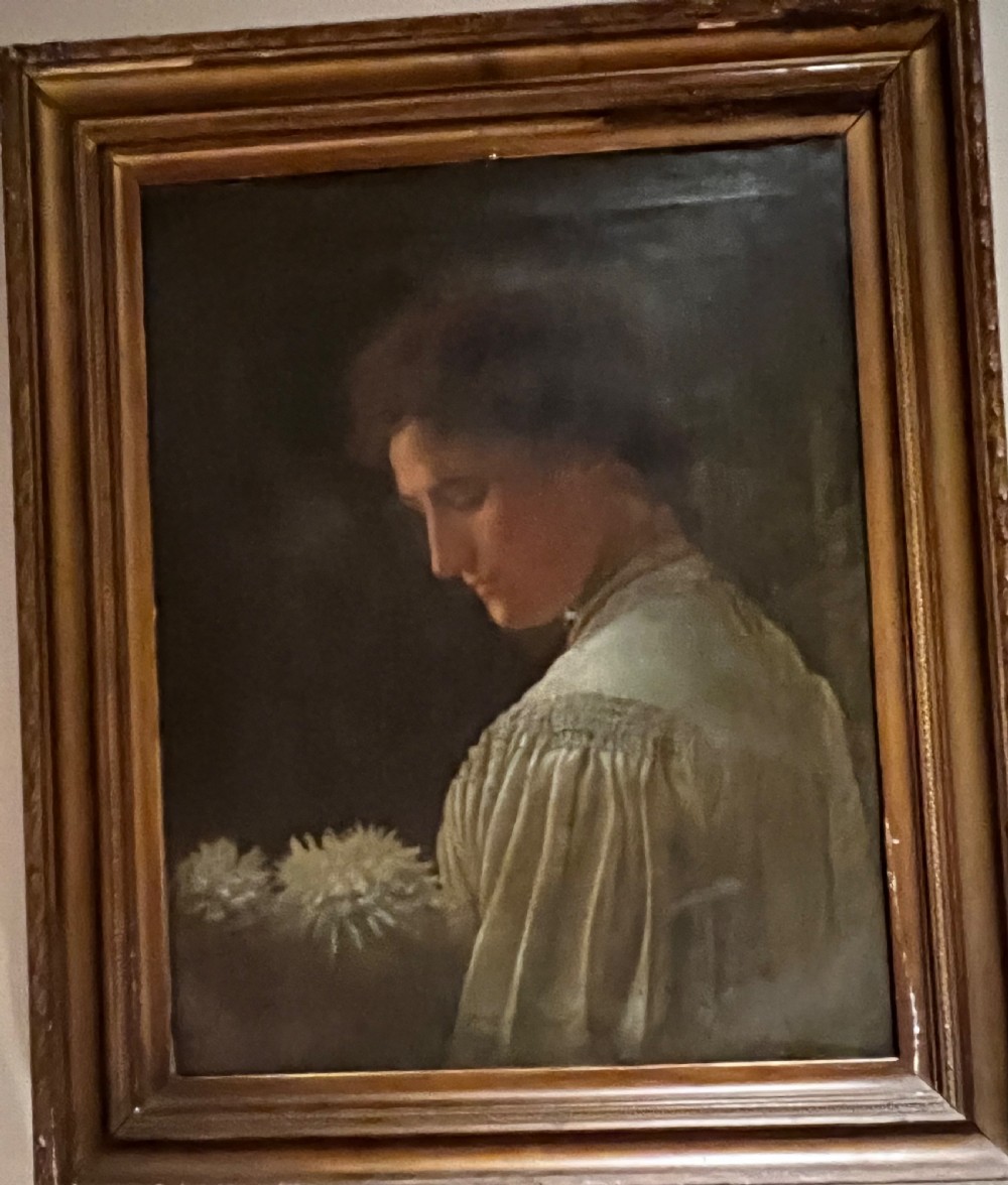 A 19th-century English School oil painting depicting a profile portrait of a woman wearing a pleated cream dress, housed within a moulded gilt wood frame.