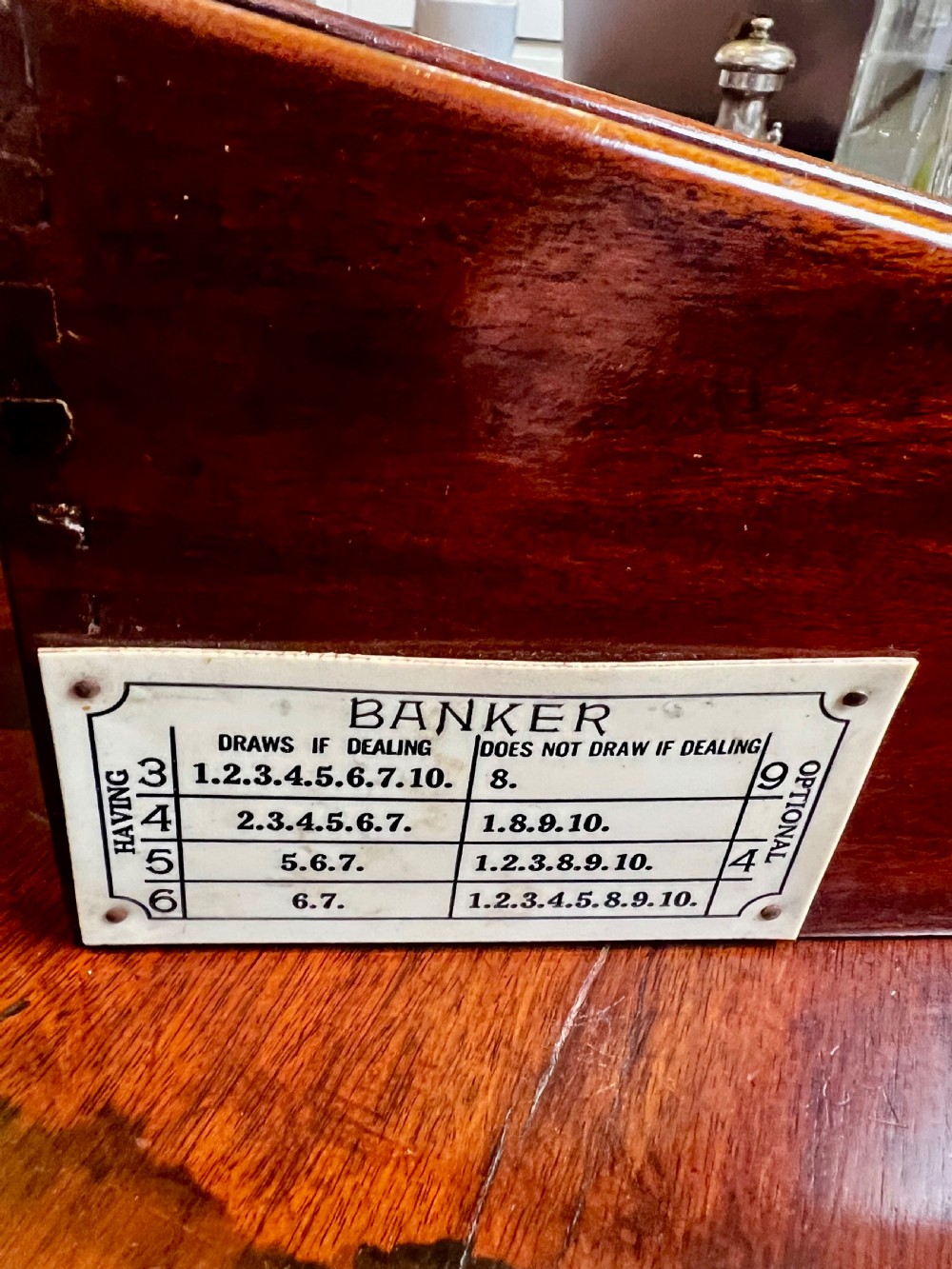 A vintage mahogany card shoe featuring a brass weighted dispensing mechanism and exposed grain. View III