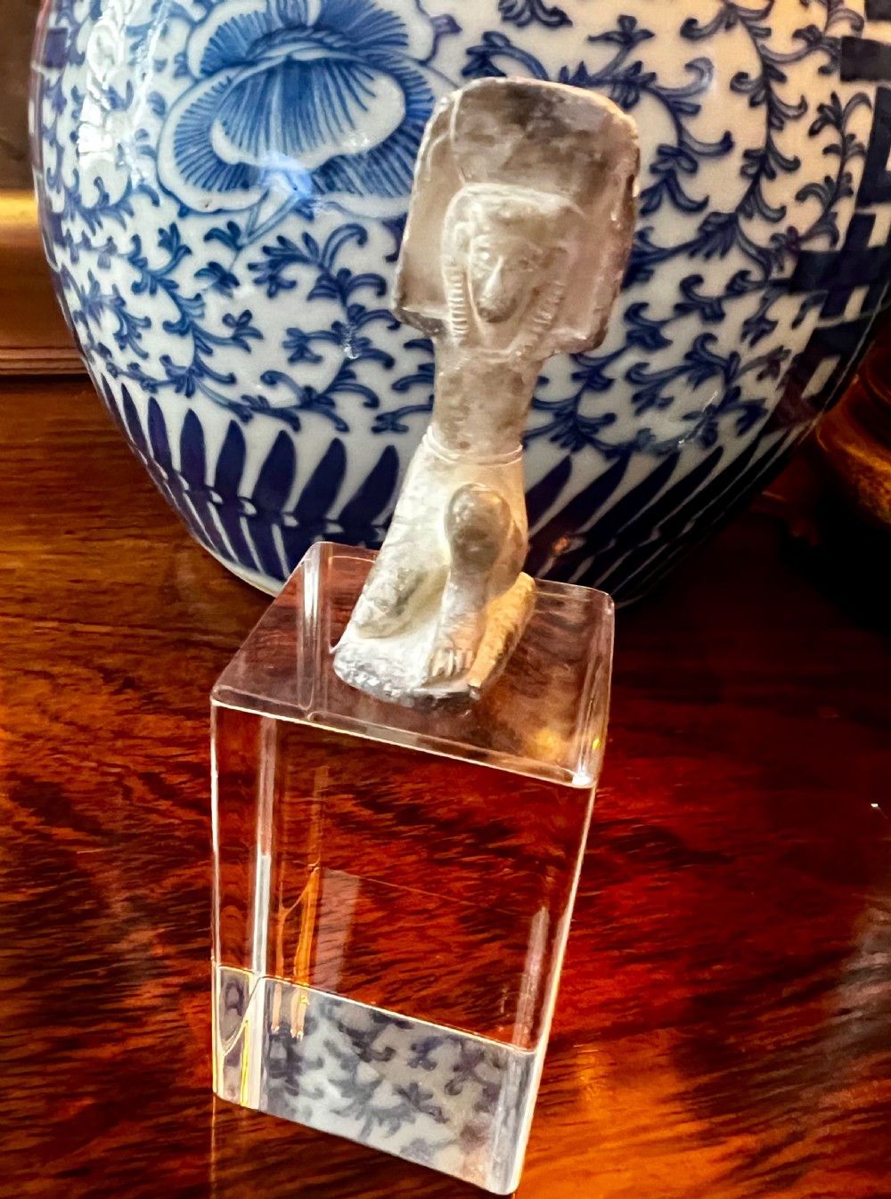 Four carved grey stone Egyptian scarabs and deity figurines displayed individually on clear acrylic block stands. View VIII