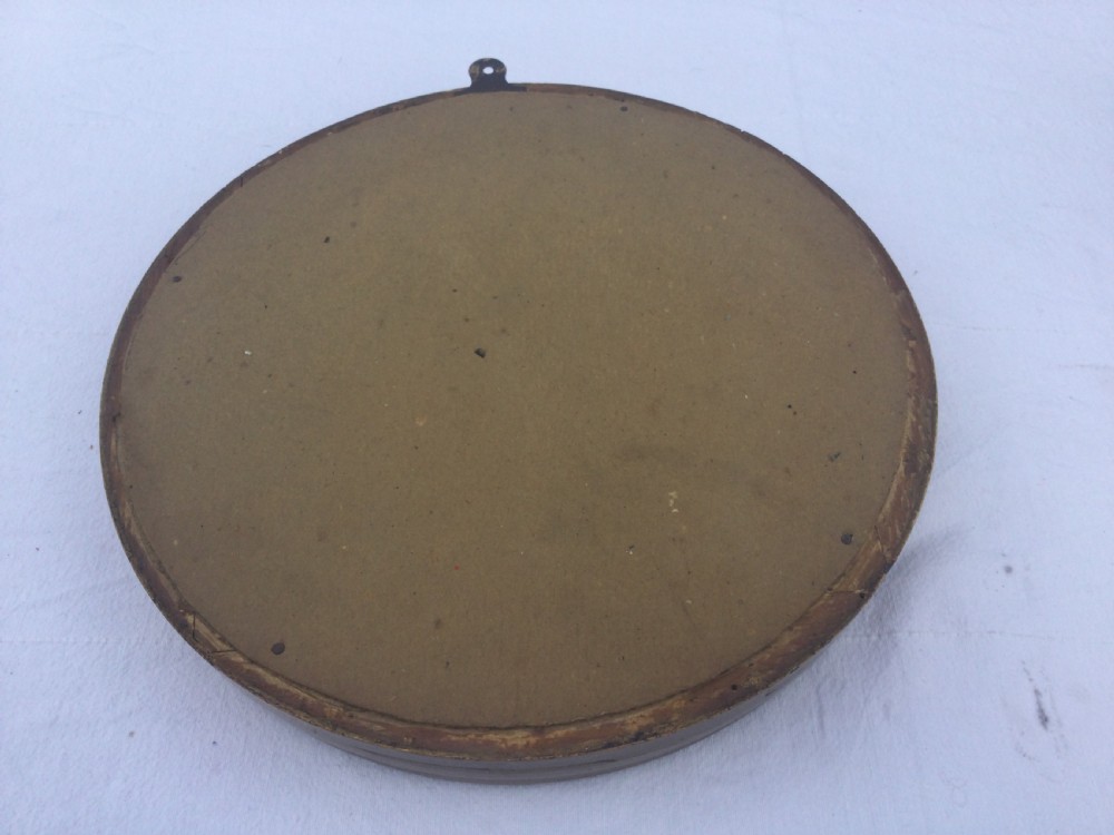 A circular Regency style convex wall mirror featuring a gilded frame decorated with evenly spaced ball ornaments around the cavetto moulding. View III