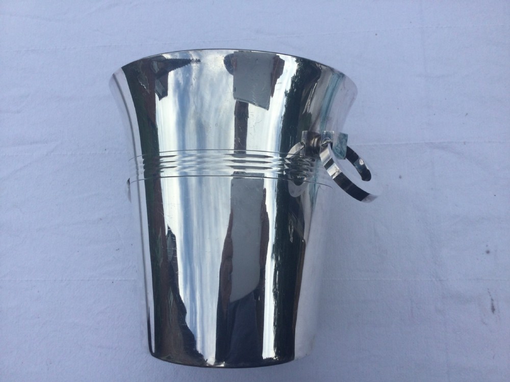 A polished silver-plated champagne bucket featuring reeded horizontal band decoration and ring side handles. View III
