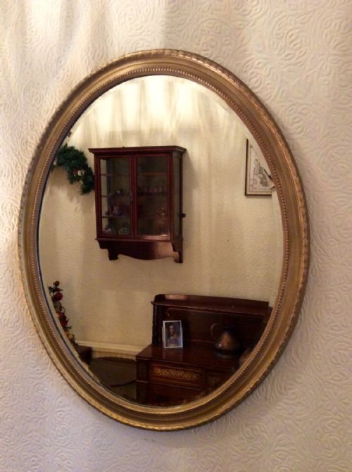 oval gilt wall mirror - CATEGORY: ANTIQUE MIRRORS - DATED VICTORIAN