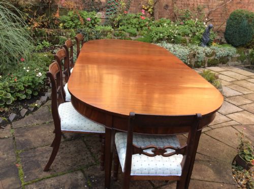 A LARGE GEORGIAN MAHOGANY DINING TABLE - ADDITIONAL PHOTO 1
