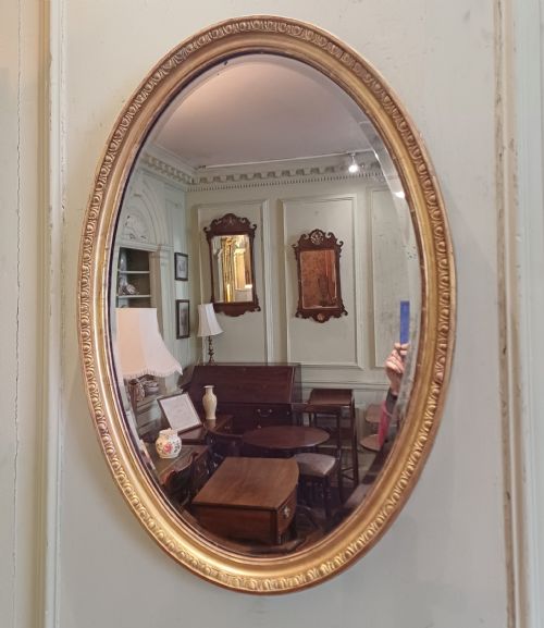 oval giltwood gilt mirror - CATEGORY: ANTIQUE MIRRORS - DATED 19TH CENTURY