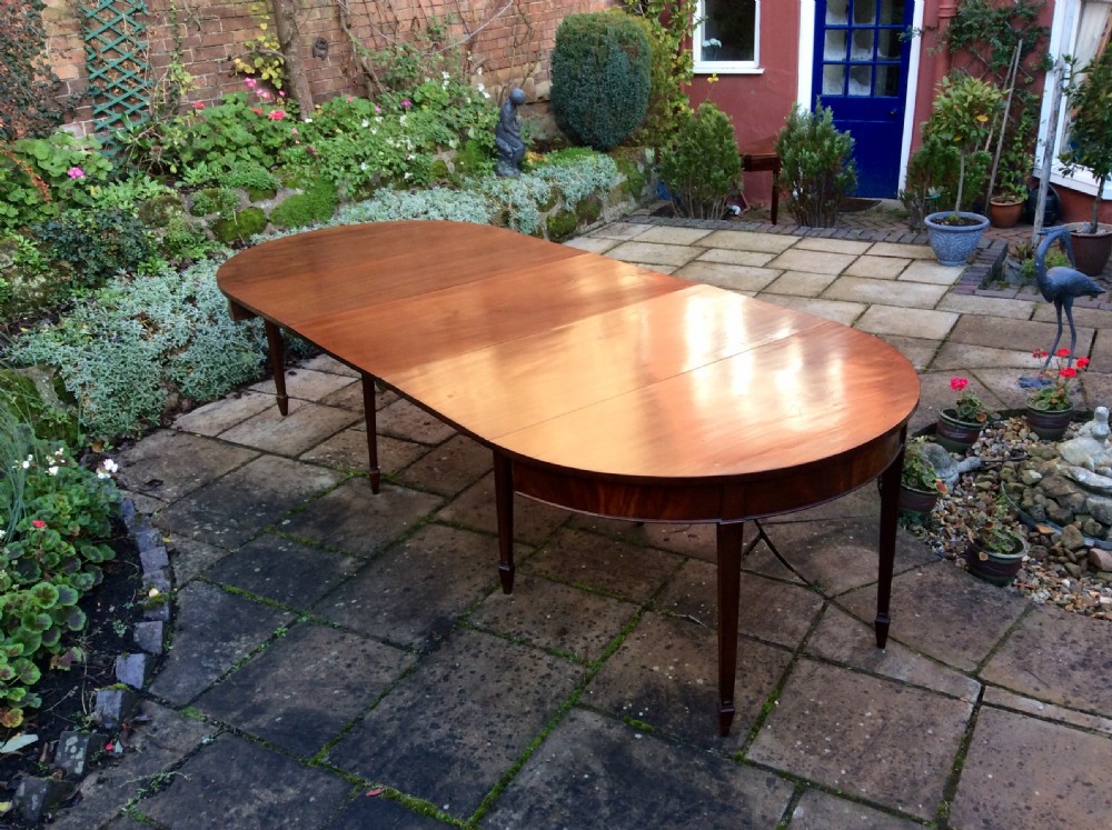 A large Georgian mahogany dining table View IV