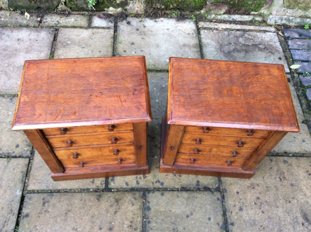 A pair of miniature oak chest of drawers View III