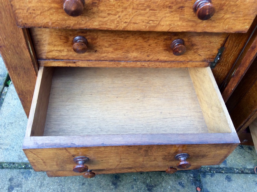 A pair of miniature oak chest of drawers View IV