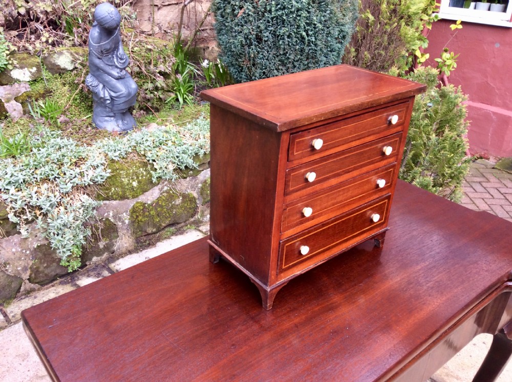 Miniature mahogany chest of drawers View II