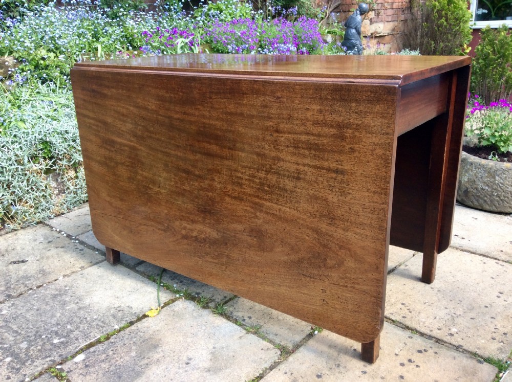 A large drop leaf mahogany dining  table View III