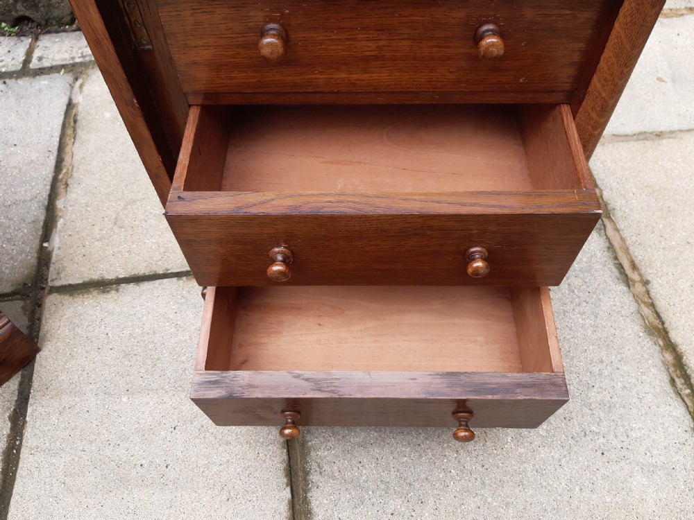 A pair of small oak set of  drawers View VII