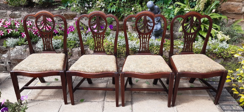 Four Georgian mahogany dining chairs